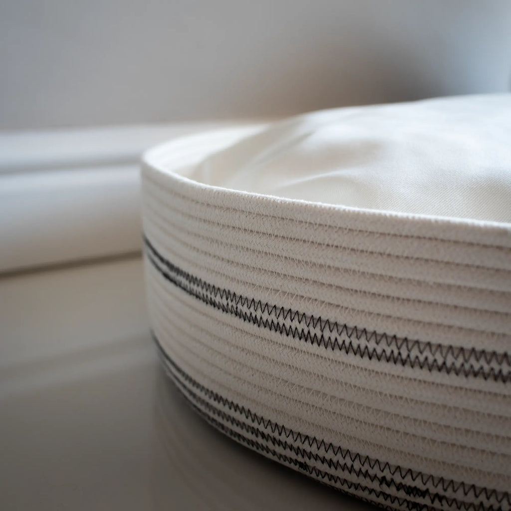 Round cat bed basket with a cotton twill cushion by Nep + Plu. Made in Cape Town.