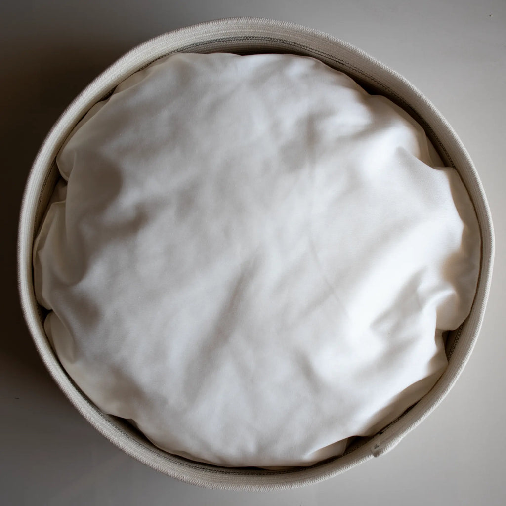 A modern round cotton rope cat bed with a cotton twill cushion by Nep + Plu and Mia Mélange. Made in South Africa.