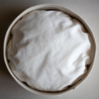 A modern round cotton rope cat bed with a cotton twill cushion by Nep + Plu and Mia Mélange. Made in South Africa.